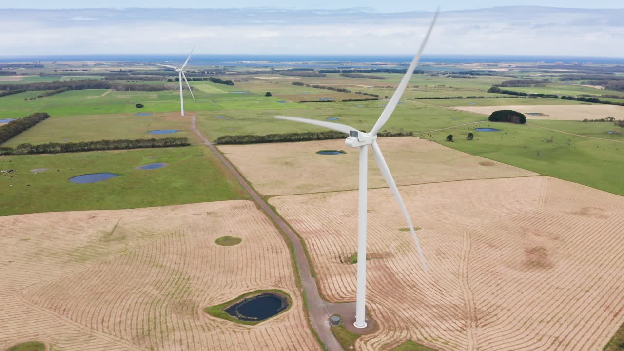 Large Wind Turbines spinning off the coast. Sustainability. Renewable Energy. 4k