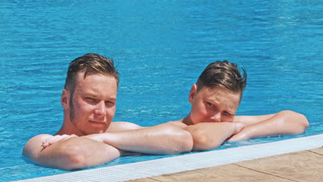cute brothers in swimming pool