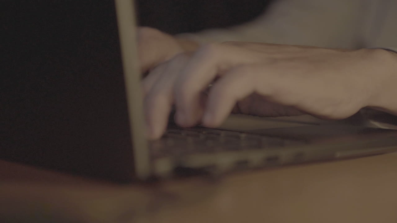 Person Typing on a Laptop