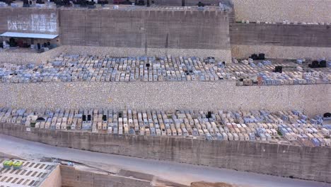 aerial view of a large terraced hillside cemetery
