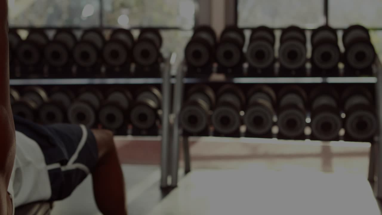 Man lying on bench gripping dumbbell pressing reps and building strength, finance charts overlaying