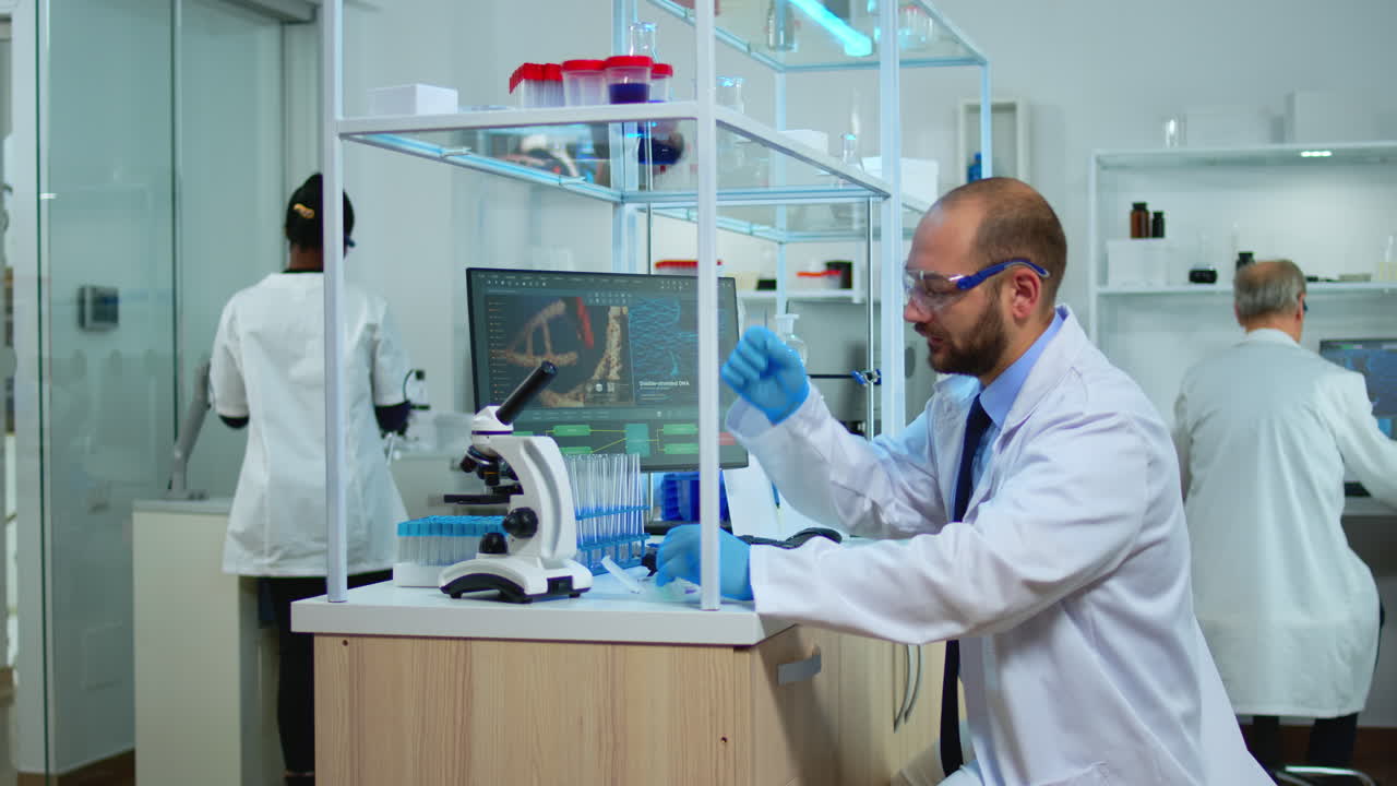 Multiethnic team of scientist working in medical laboratory