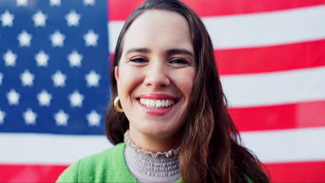 woman smiling in front of american flag