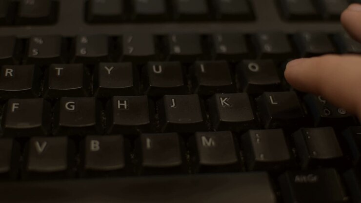 Typing HELLO on a dark keyboard