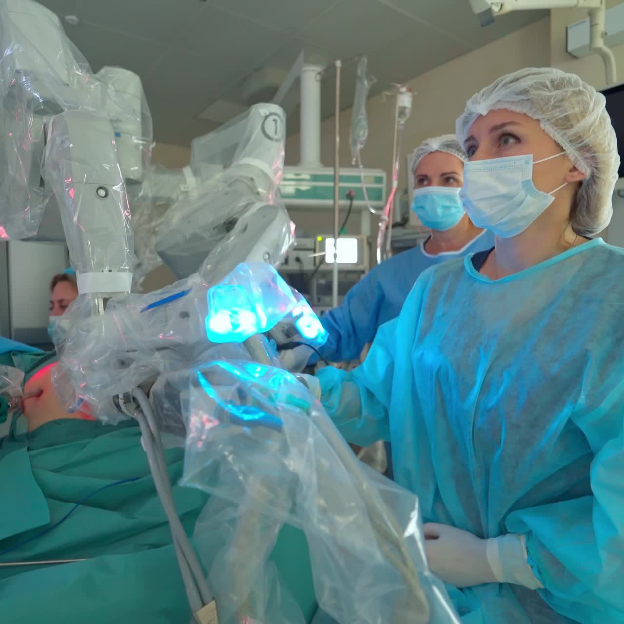 Surgical Laparoscopic Medical Operation. Diverse group of doctors and assistants performing serious surgical operation in modern hospital