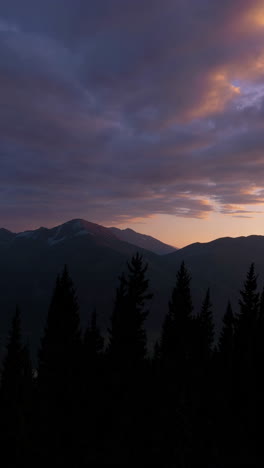 mountain sunset with silhouette trees