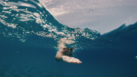 man swimming in the ocean