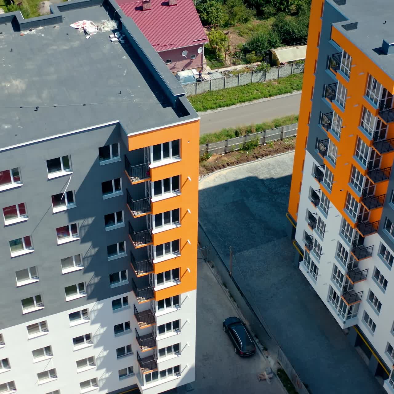 Apartment buildings with colorful walls. Modern residential apartments. Newly built block of flats for city residents. View from above