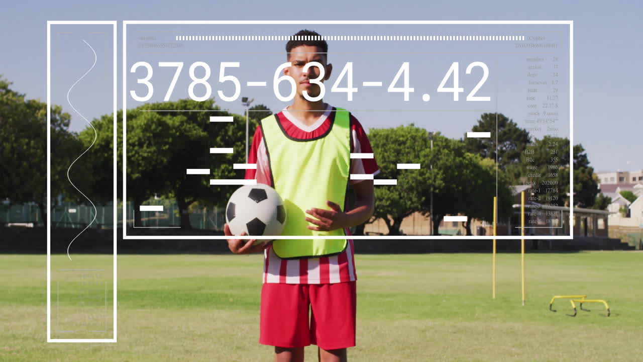 Soccer player holding ball with numerical data animation overlay on field