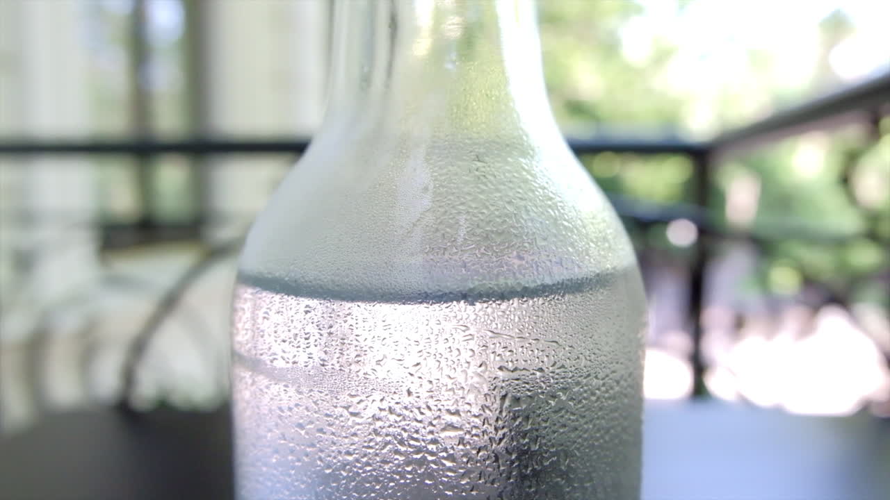 Close up of a bottle of an natural mineral water on a table at a restaurant