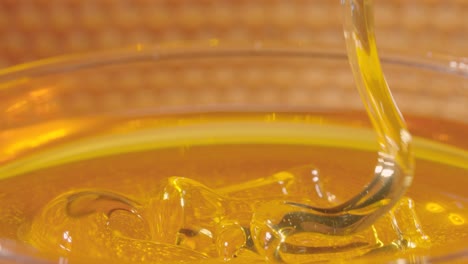 honey pouring into bowl
