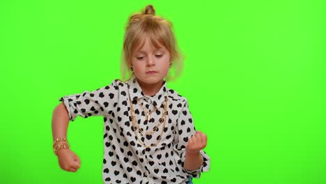 Cheerful-little-kid-child-girl-having-fun-dancing-and-moving-to-rhythm,-dabbing-raising-hands