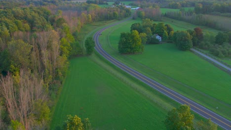 Stafford-road-drone-shot-near-the-Joseph-Smith-family-farm,-frame-house,-temple,-visitors-center,-and-the-sacred-grove-in-Palmyra-New-York-Origin-locations-for-the-Mormons-and-the-book-of-Mormon