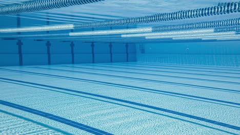 olympic swimming pool under water background.