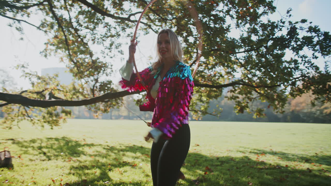 Friends Playing with Hoops in a Park