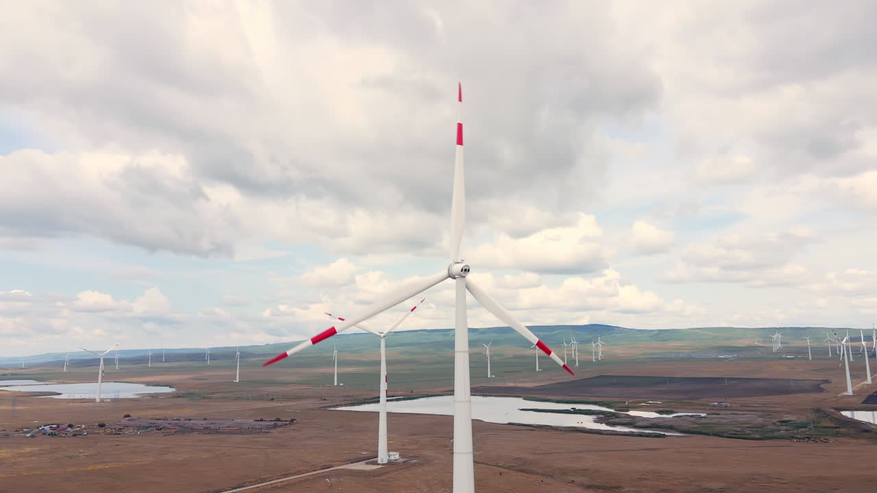 Alternative energy production on the wind power station with windmills