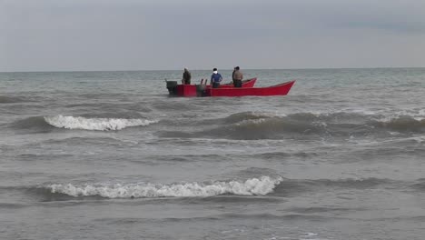 fishermen on motor boats off the coast of iran