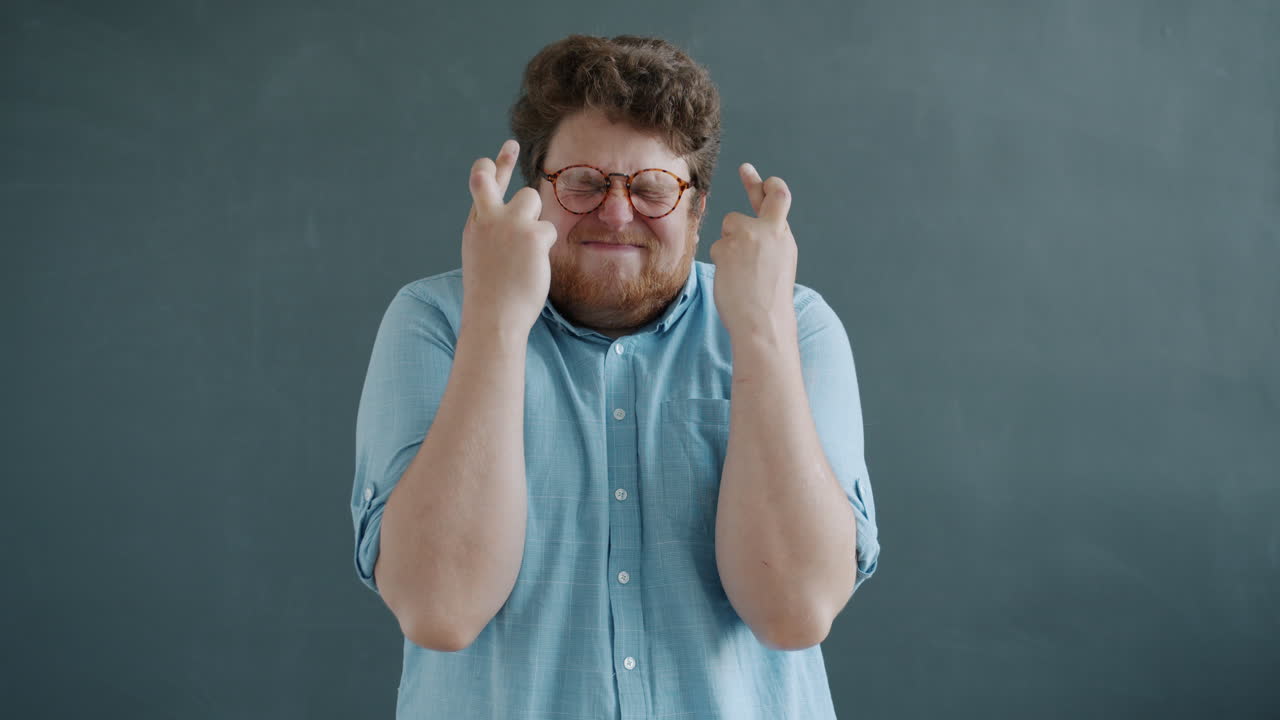 Man Crossing Fingers