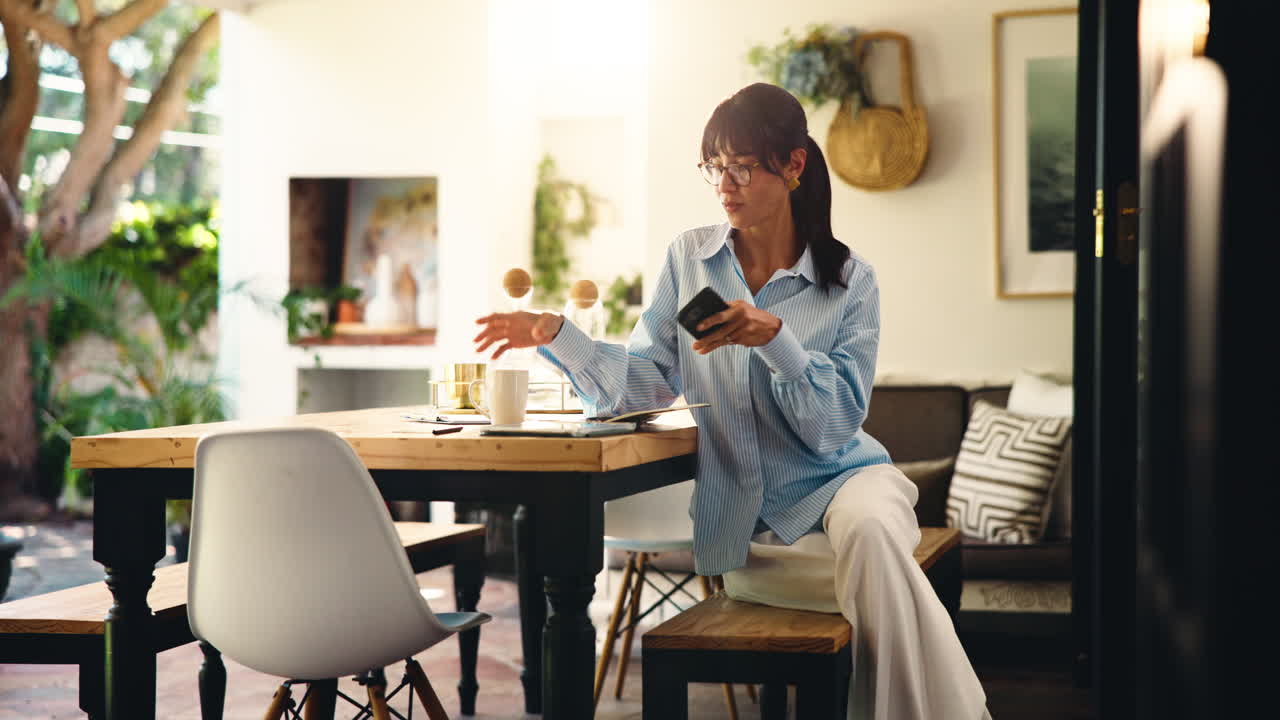 Woman sitting at a table indoors