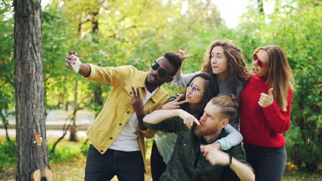 friends taking a selfie in autumn park