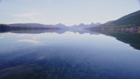 underwater and above water view of autumn scene looking across lake in montana