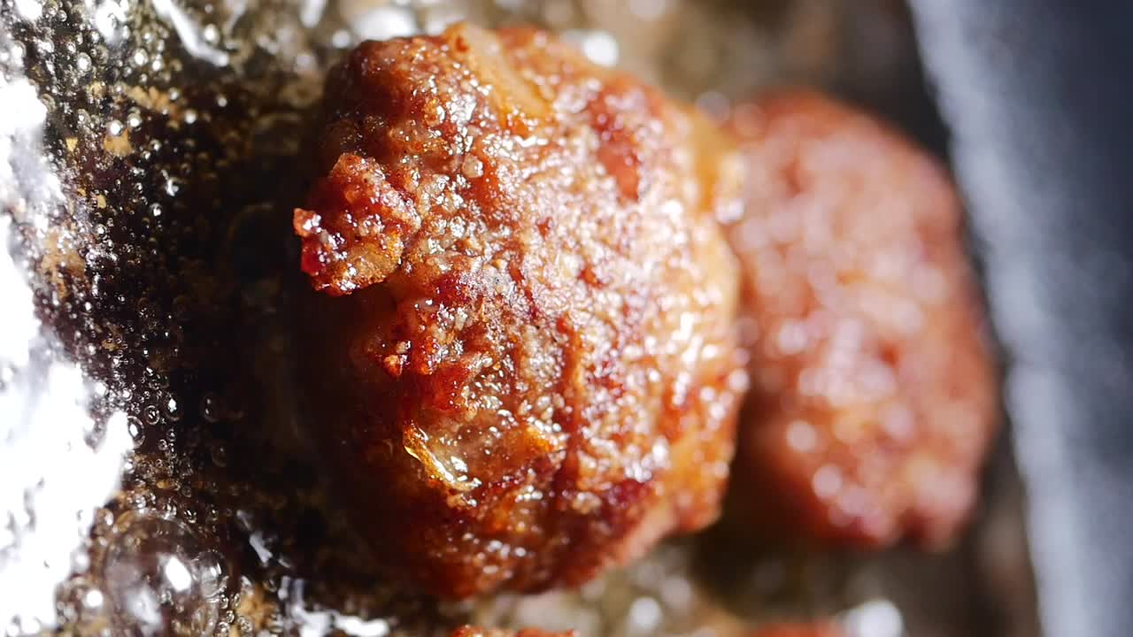 Meatballs being cooked in a pan