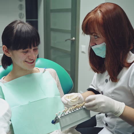 dentist and patient in dentist office. dental clinic.