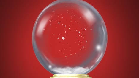 animation of christmas snow globe with snow falling on red background