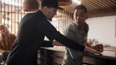 bartender assisting a customer at a bar