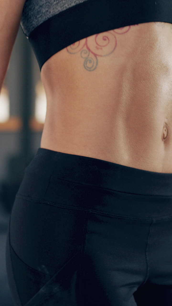 Close Up of Fit Woman's Abs During Core Workout