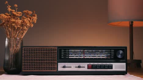 old retro am fm radio with tubes, hand changing stations , bulb vintage music player.