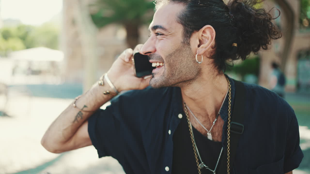 Man talking on his phone outdoors