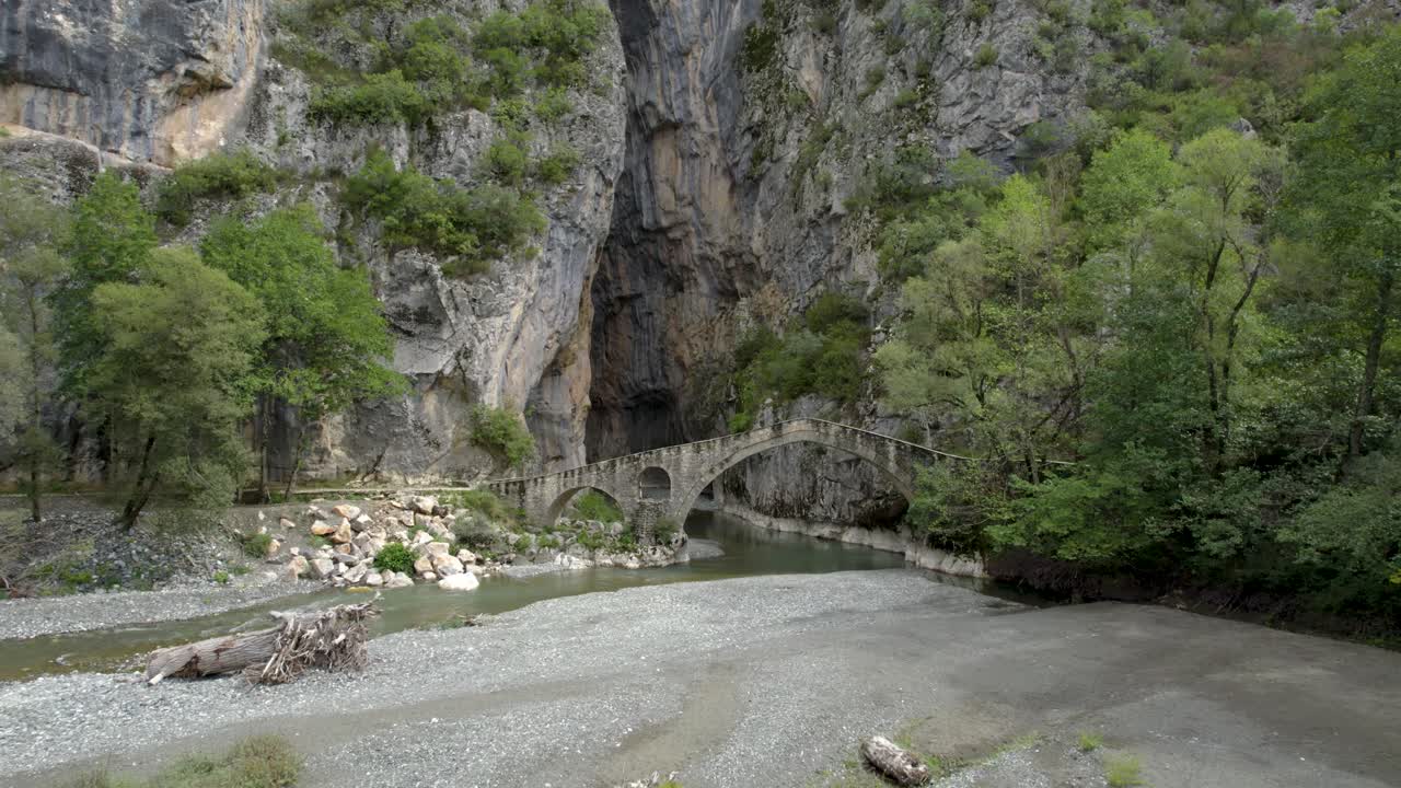 Portitsa Gorge in Grevema Greece, Aerial Pullback Shot, Panoramic View of Stone Bridge and River