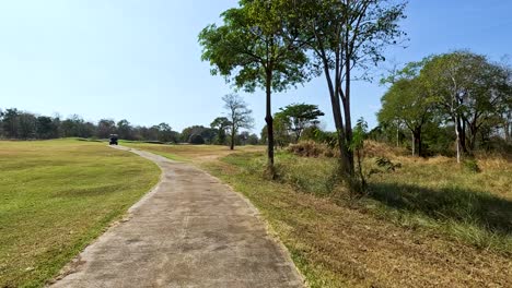 a serene golf course pathway in thailand