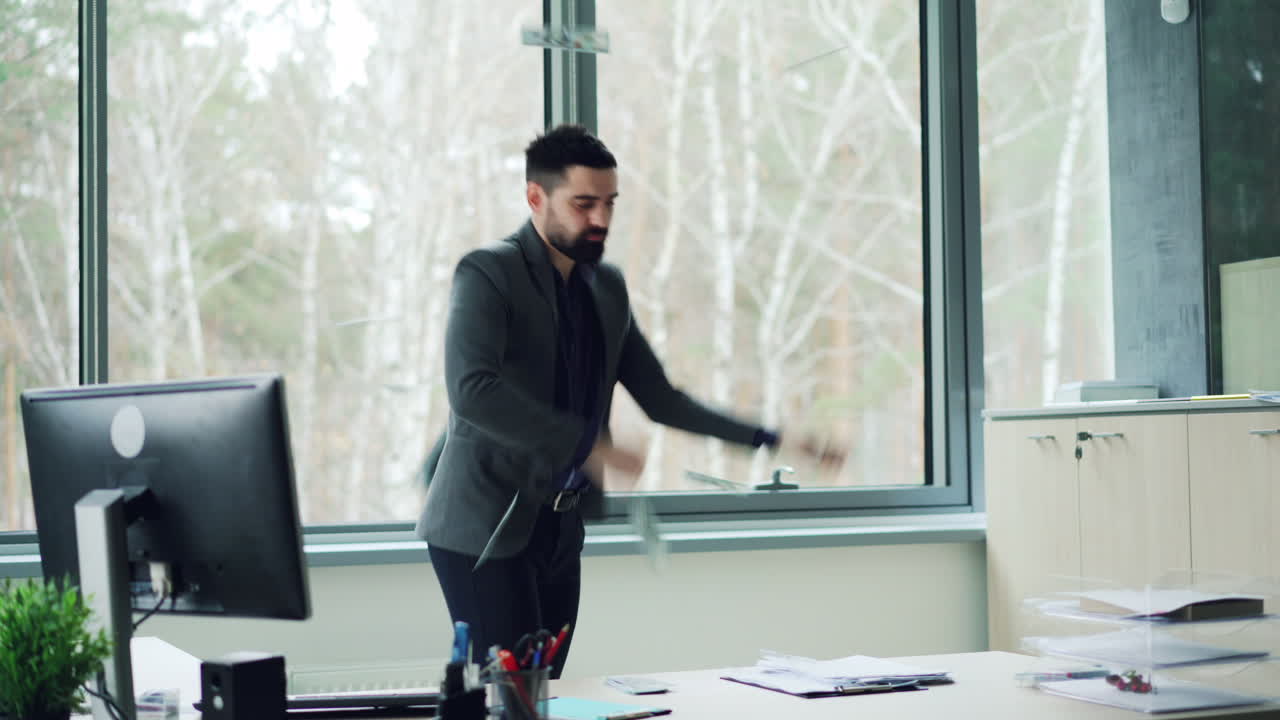 Happy Businessman Celebrating in Office