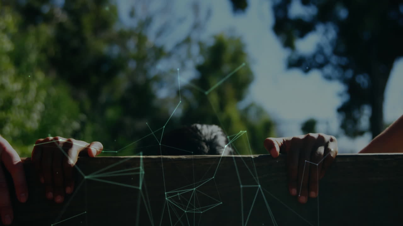 Animation overlay of digital network lines with child peeking over wooden fence