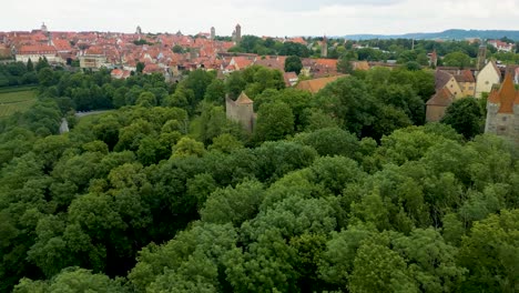 4k aerial drone video of the forest outside the town wall of rothenburg ob der tauber, germany