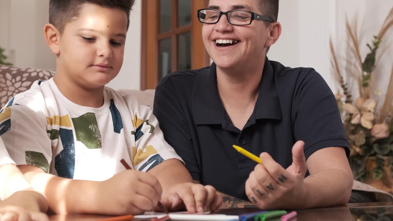 Mother encouraging her children while doing crafts