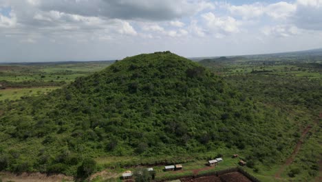 flying away from green vivid hill in africa, south kenya