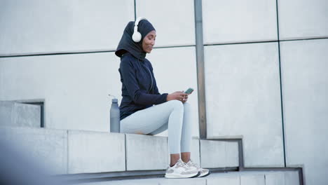 Muslim-woman,-phone-and-headphones-for-exercise