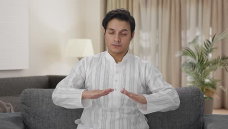 Indian-man-doing-breathe-in-breathe-out-exercise