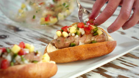 detail shot, preparing a choripan with baguette bread