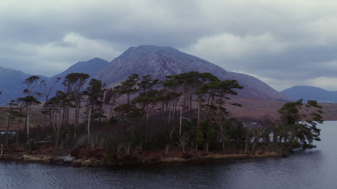 Aerial drone footage of Pine Island and the Twelve Bens under a dramatic stormy sky, Connemara