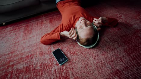 woman relaxing on floor with headphones