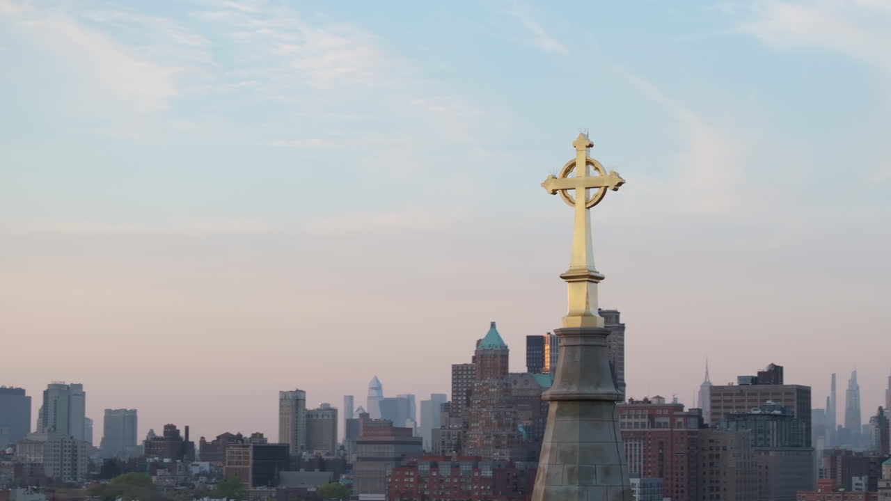 Aerial view of a crucifix on top of a church steeple in New York City