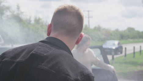 Male-And-Female-Drivers-Getting-Out-Of-Cars-After-Auto-Accident