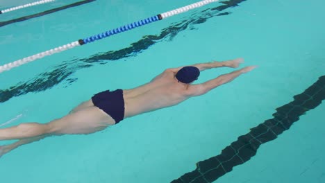 swimmer swimming into the pool