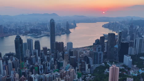 cinematic aerial view of hong kong skyline featuring ifc and icc towers, symbolizing global finance, modern architecture, and a vibrant hub for travel and business