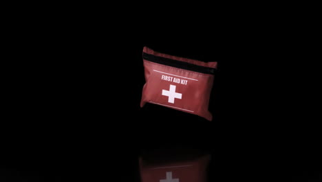 first aid kit falling on black background