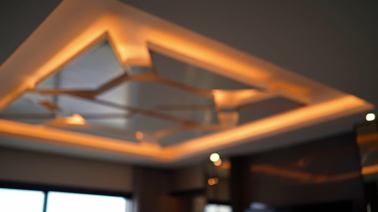 Elegant Modern Ceiling Design with Ambient Lighting Creating a Warm and Inviting Atmosphere in a Contemporary Interior Space